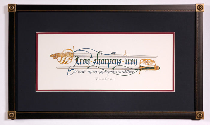 Proverbs 27:17 Iron sharpens iron scripture with swords. Holly Monroe framed calligraphy.