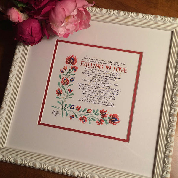 Carved white framed Falling in Love quote by Pedro Aruppe and calligrapher Holly Monroe